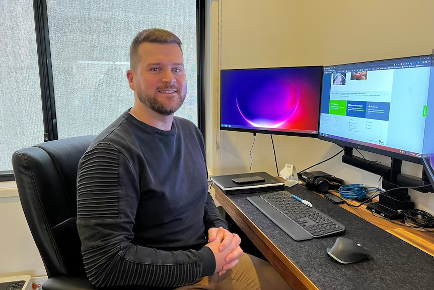 Jon from Think Web at his desk